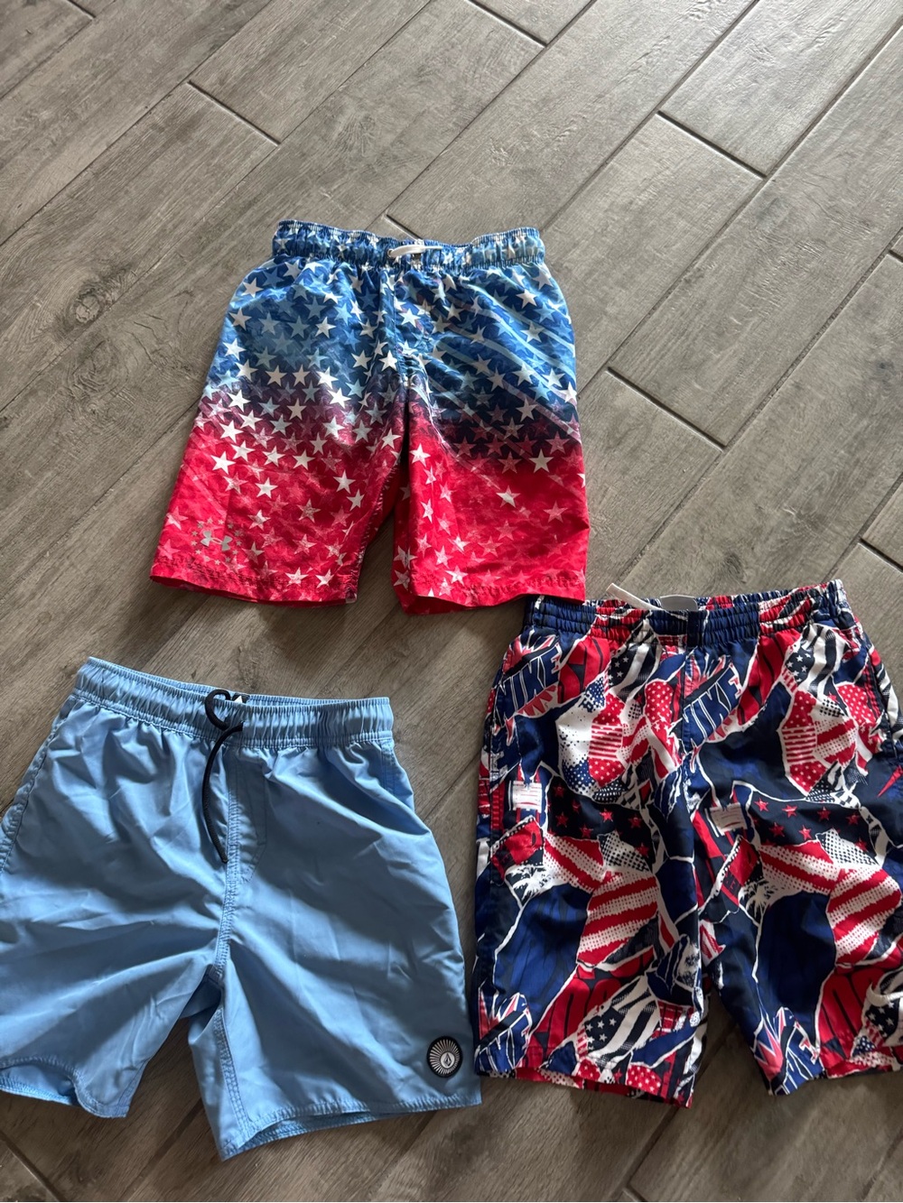 3 swim trunks. All medium. Volcum, Nike, under armor.